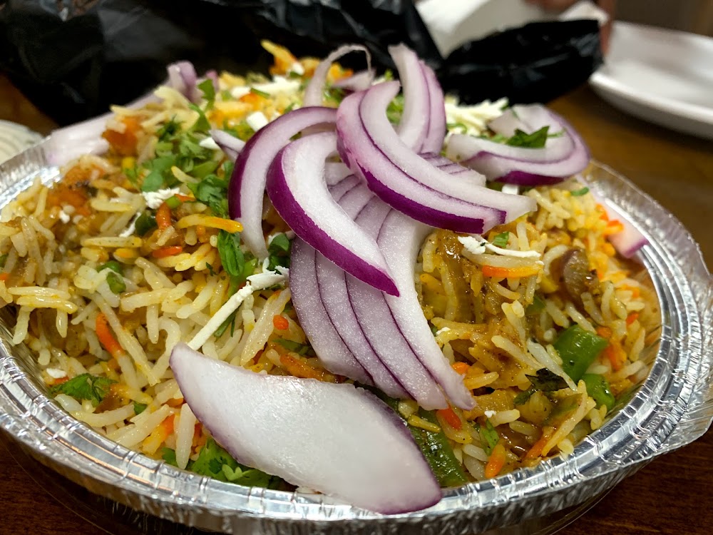 Bollywood Grill signature dishes Chicken Tikka MasalaChicken BiryaniPaneer Biryani